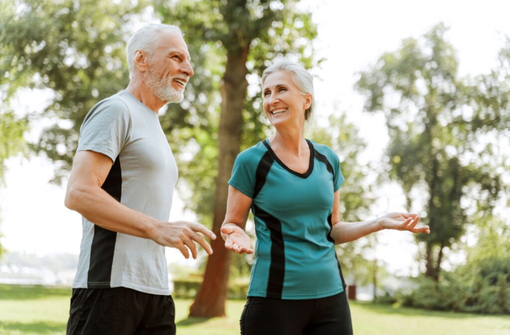 Seniors exercising outdoors supporting cardiovascular health and joint mobility through regular physical activity.